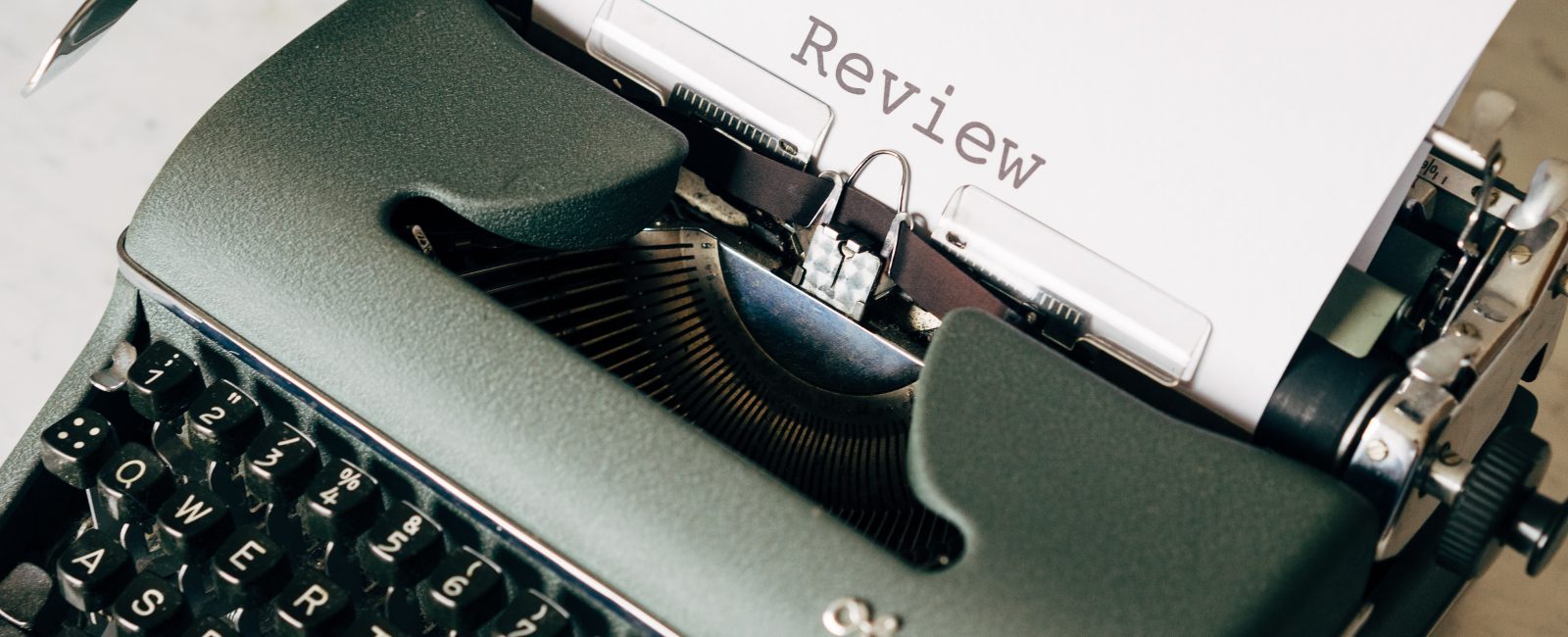 black and white typewriter on white table