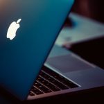 MacBook Pro on black surface