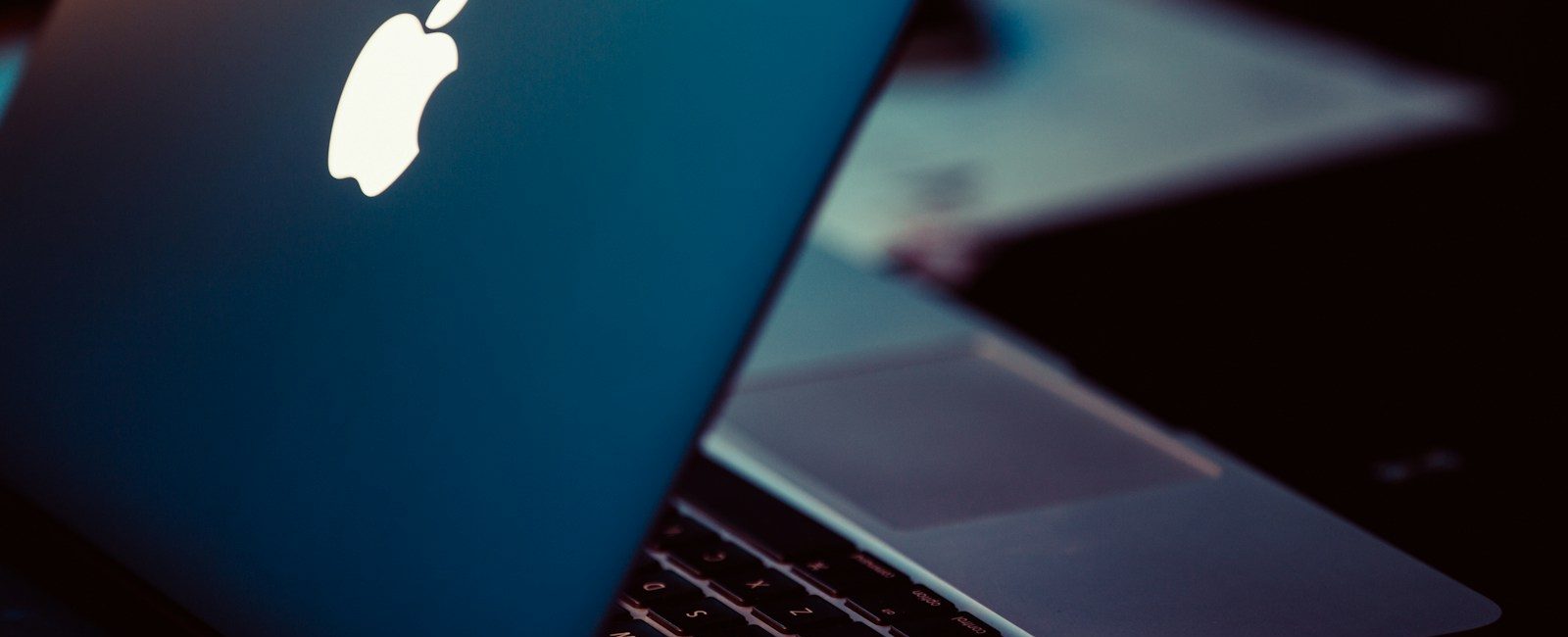 MacBook Pro on black surface