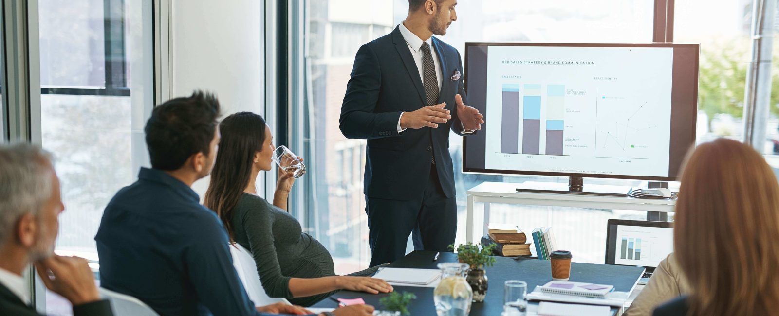 Salesperson talking with a modern buyer during a training inspired conversation